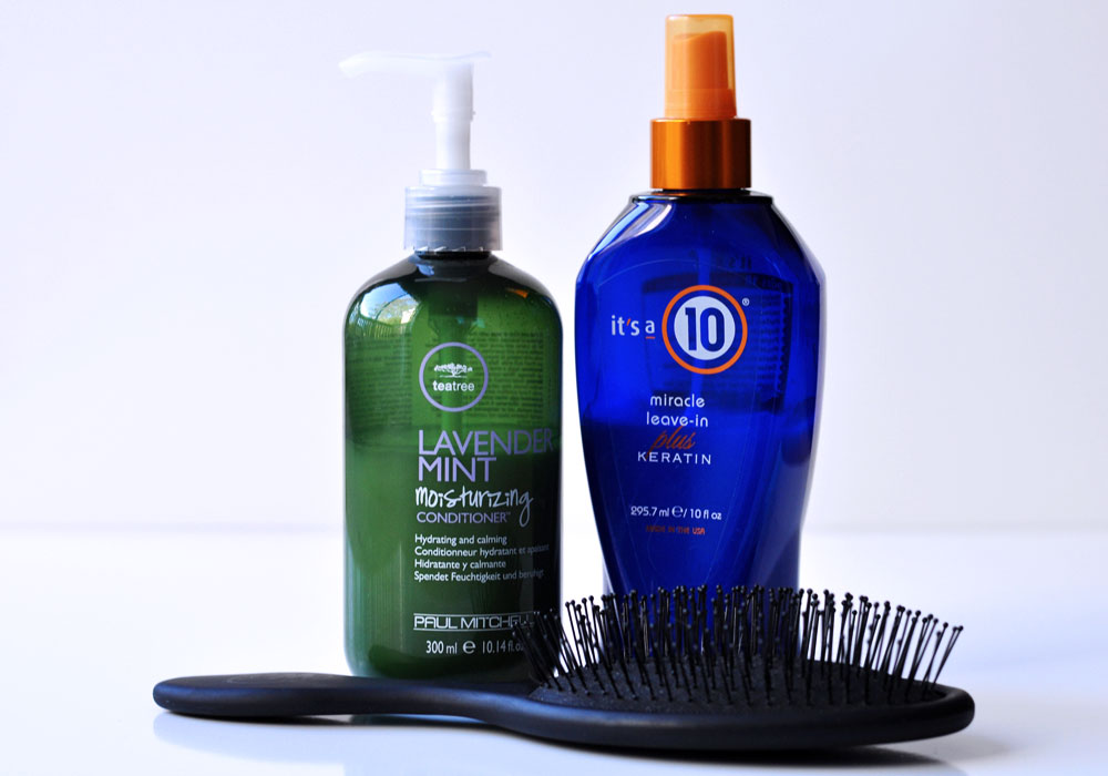 How I tamed my frizzy hair using 3 products - paul mitchell lavender conditioner, it's a 10 leave in spray, and the wet brush